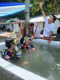 A  divemaster conducting an intro to scuba